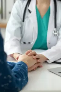 Concierge-Medicine-Treatment A clinician holds hands with a patient with compassion. Get concierge health and wellness services from Susan Ashley, M.D. in Spokane, Washington.